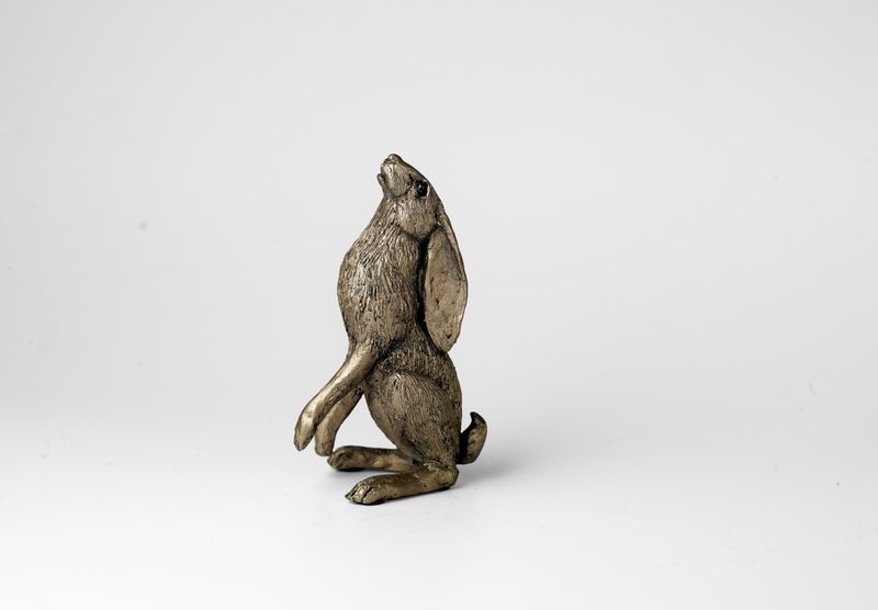 Moongazing Hare cold-cast bronze sculpture by Jonny Sanders, a small seated hare gazing upwards with ears back