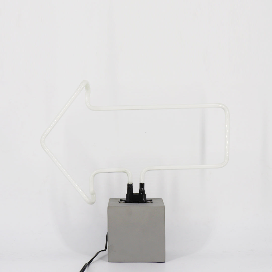Neon Arrow Sign product image shown in a home or gift setting