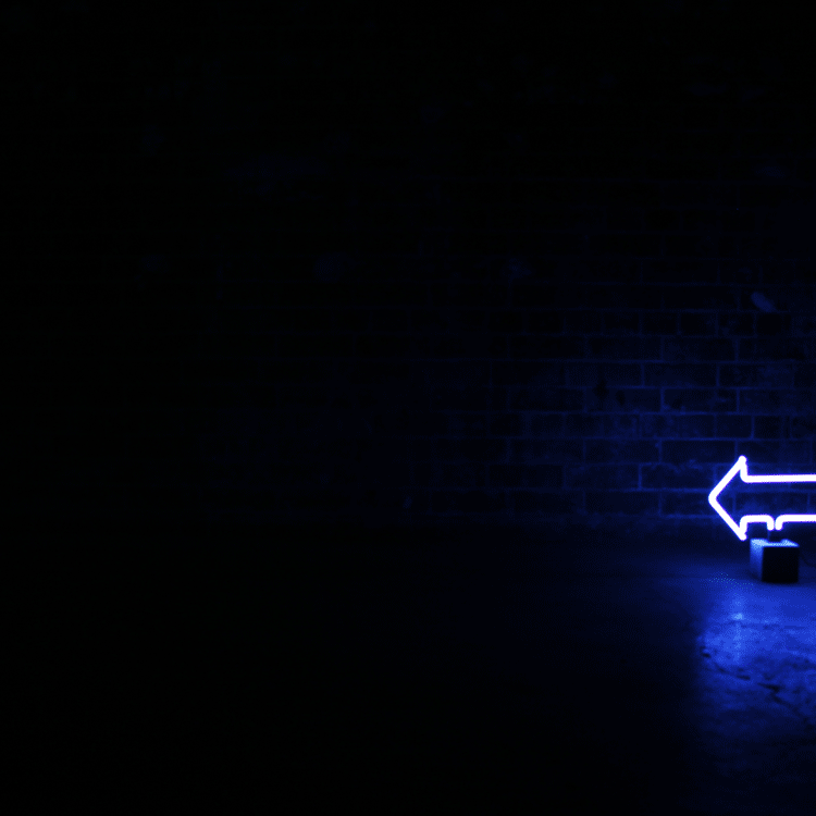 Neon Arrow Sign product image shown in a home or gift setting