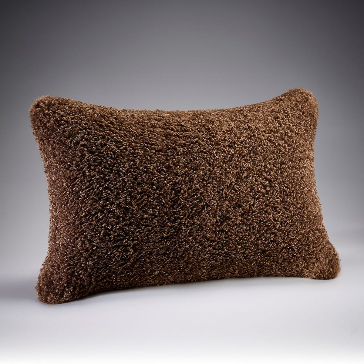 Cocoa Pebble brown curly faux fur bedroom cushion by Katrina Hampton