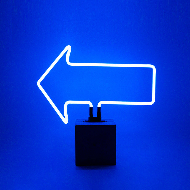 Neon Arrow Sign product image shown in a home or gift setting