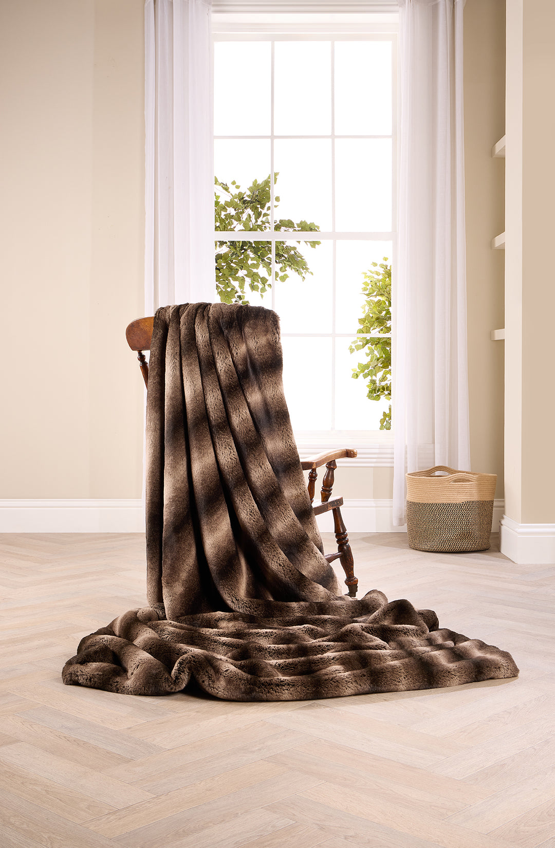 Taupe Rabbit Alaska faux fur throw on a chair