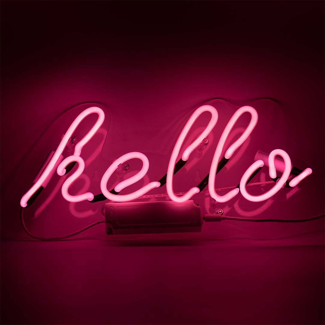 Hello Glass Neon Wall Sign   Pink product image shown in a home or gift setting
