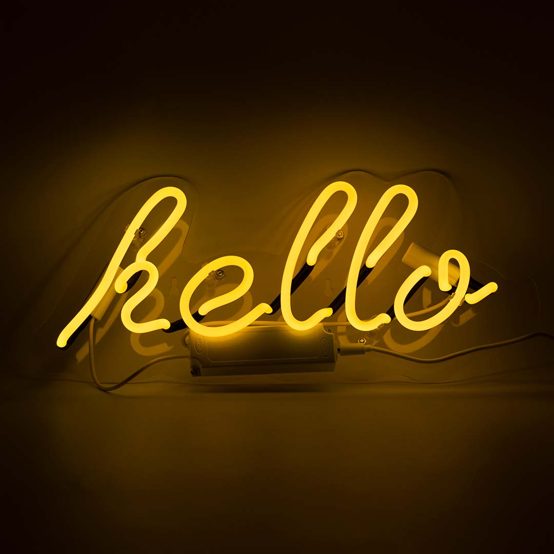 Hello Glass Neon Wall Sign   Yellow product image shown in a home or gift setting