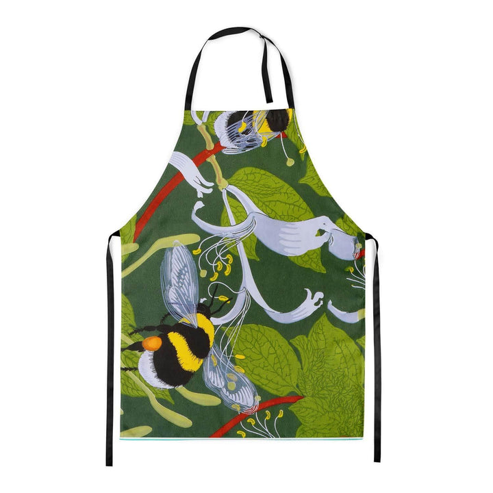 A fabric apron with black straps. Bumble bees, flowers and leaves on the front.
