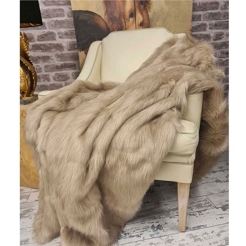 ong-haired camel faux fur throw blanket draped on chair