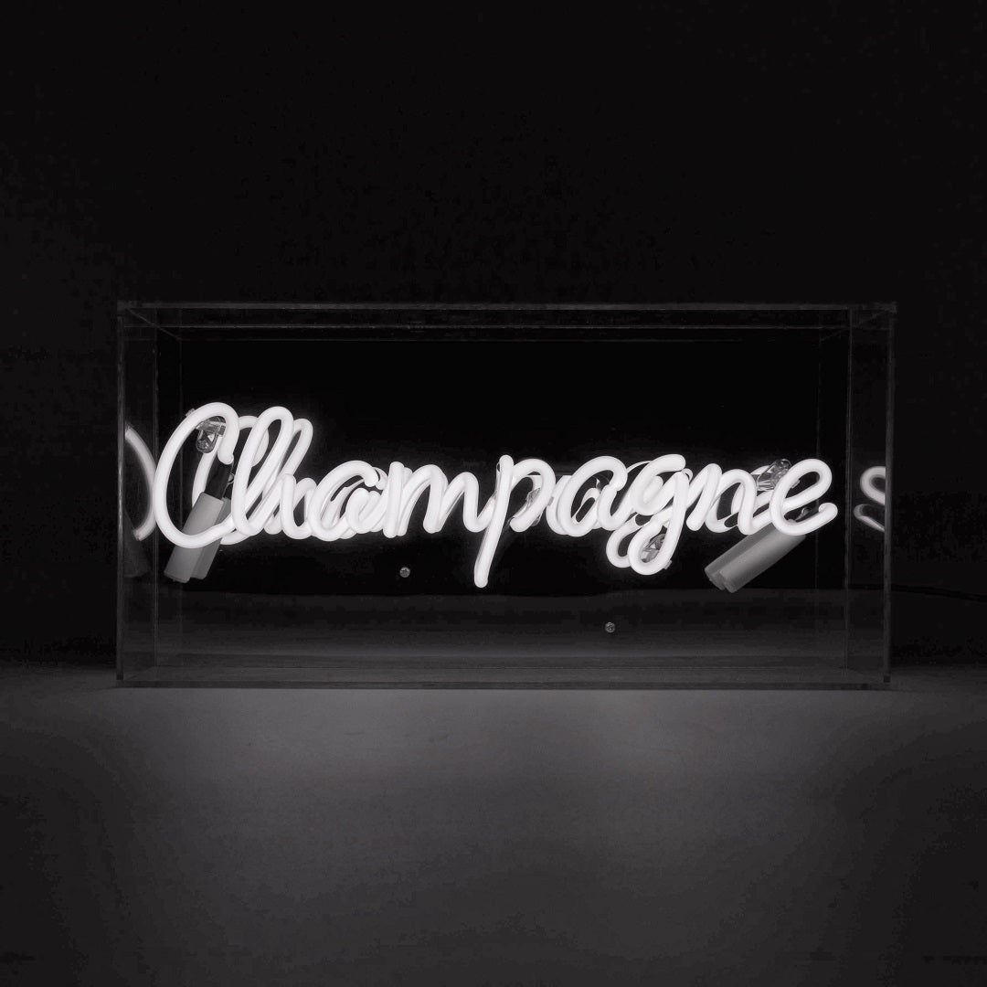 Champagne Glass Neon Sign   White product image shown in a home or gift setting
