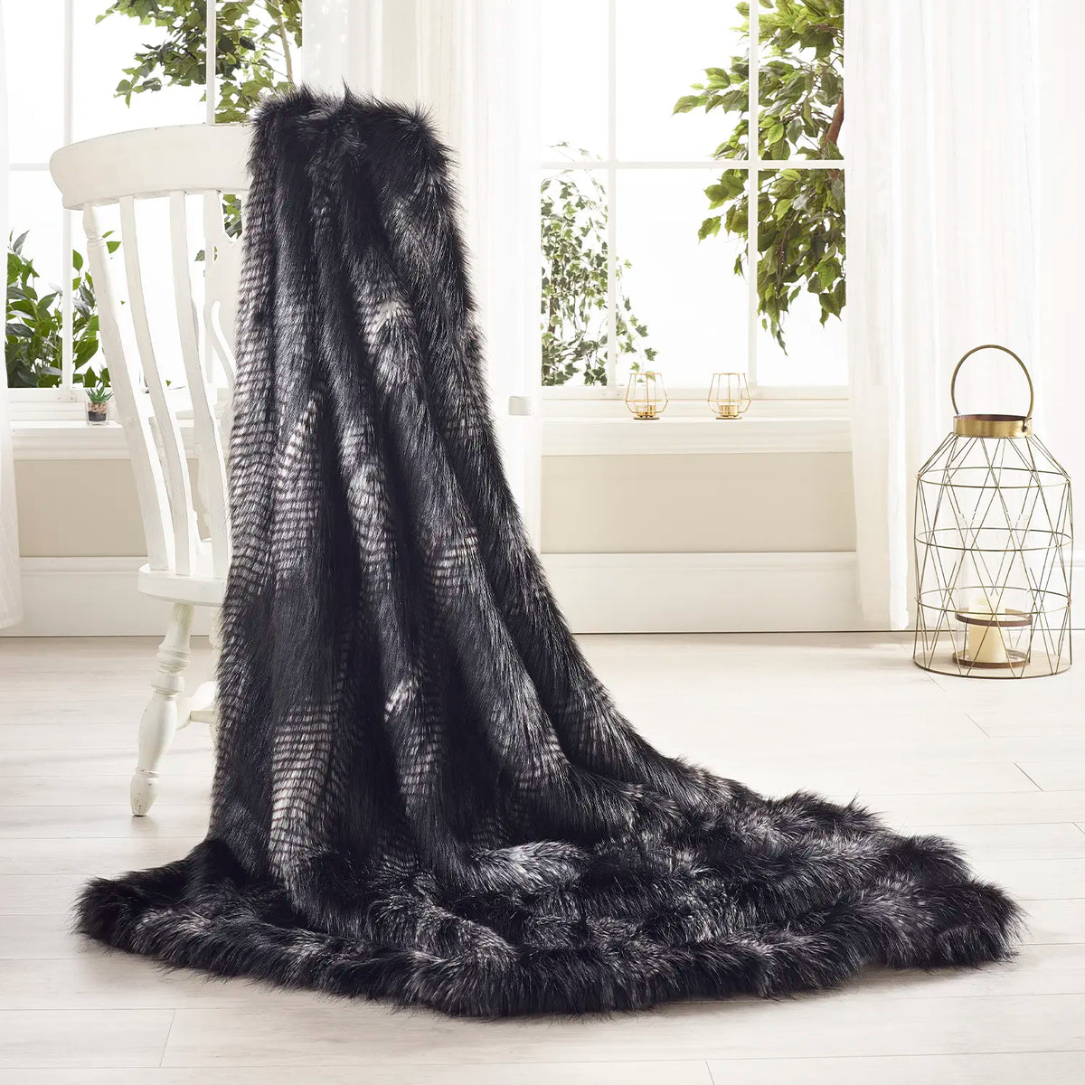 Black Peacock faux fur throw by Katrina Hampton