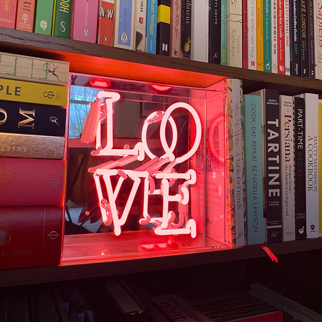 Love Glass Neon Sign product image shown in a home or gift setting