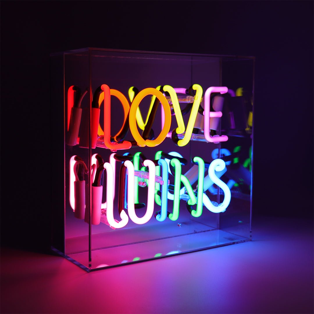Love Wins Glass Neon Sign product image shown in a home or gift setting
