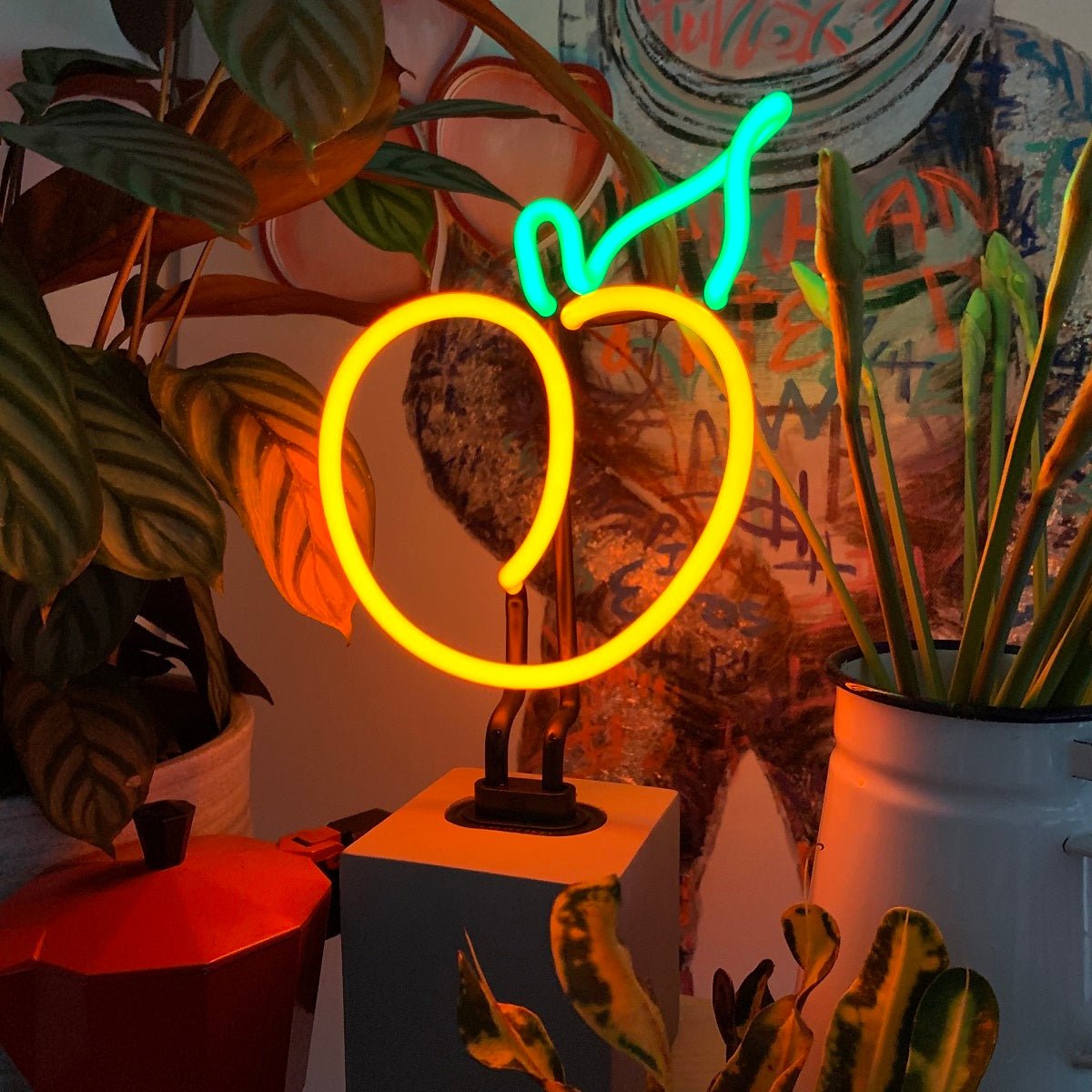 Neon Peach Sign product image shown in a home or gift setting