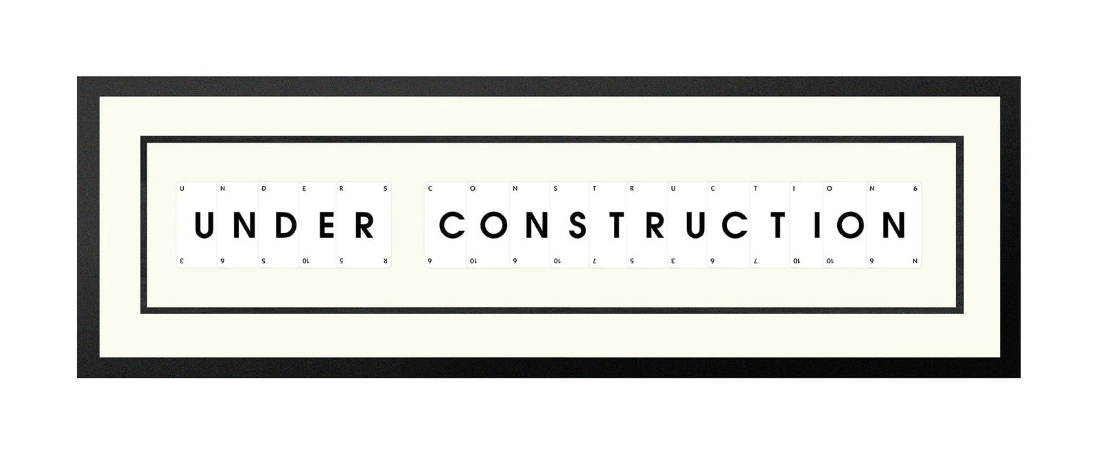 Handmade playing card picture frame spelling 'Under Construction' – framed quote wall art made in the UK.