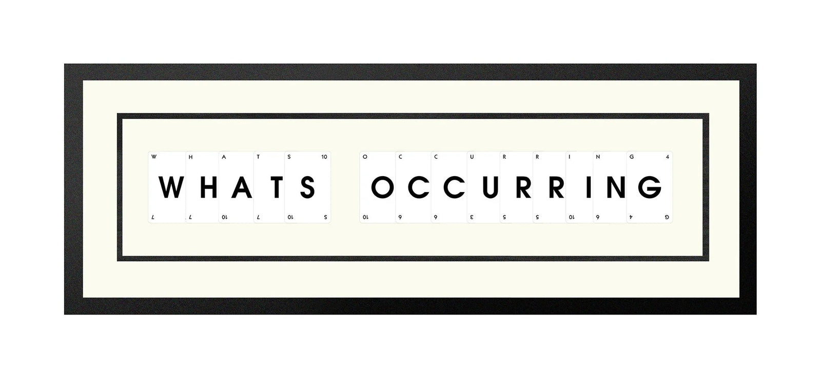 Handmade playing card picture frame spelling 'Whats Occurring' – framed quote wall art made in the UK.