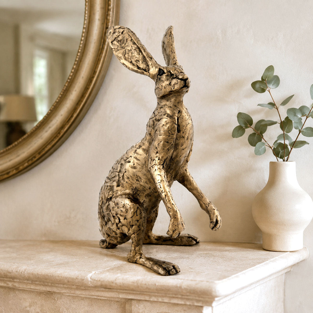Thomas the Dorset Hare bronze sculpture displayed on a stylish mantelpiece
