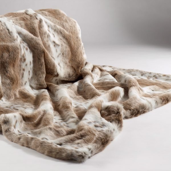 Tan Lynx faux fur bed throw with luxury tan faux suede backing laid flat