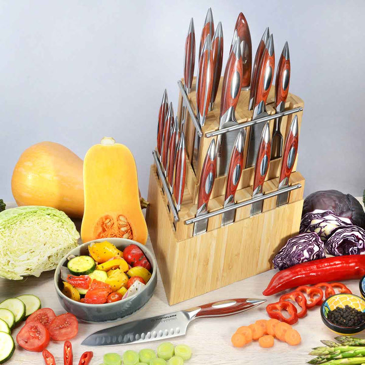 Flint and Flame professional chef twenty piece (20) knife set in a detachable two piece wooden block shown in a lifestyle setting with fruit and vegetables